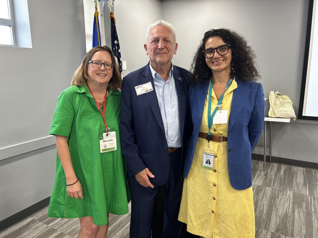 Mayor Rilling, Michelle Puzzo and Ligia Masilamani posing for a picture.